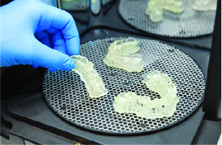 Doctor's Hand holding a 3D Printed Dental Molds